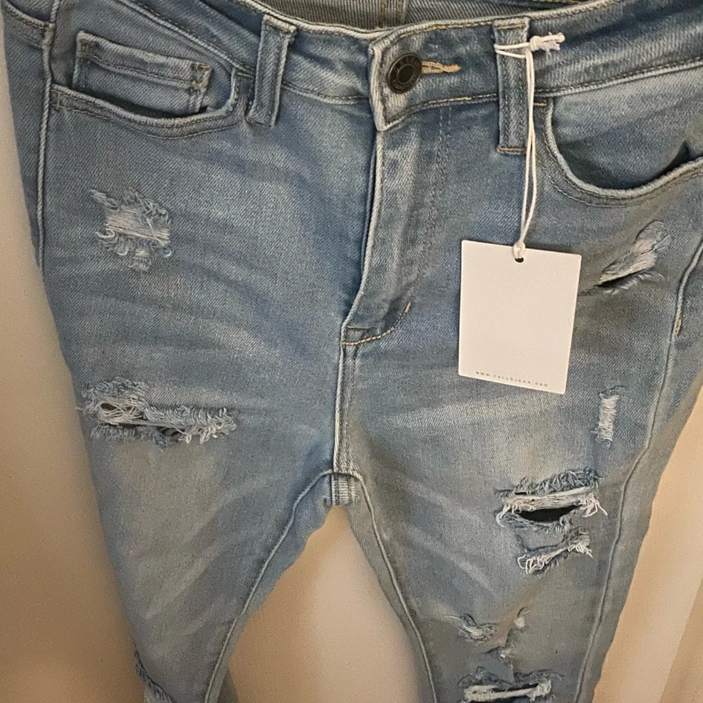 Distressed Light Blue Jeans - Picture 1 of 3